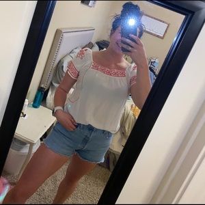 White top with red embroidery